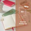 image:imageSakura Notebook Dotted A5  JapaneseInspired Dotted Notebook for Effortless Writing  140 GSM Paper  Hardcover  Expandable Inner Pocket  FlatLay Stitch Binding  51 x 83  Plum BlossomPale Patina